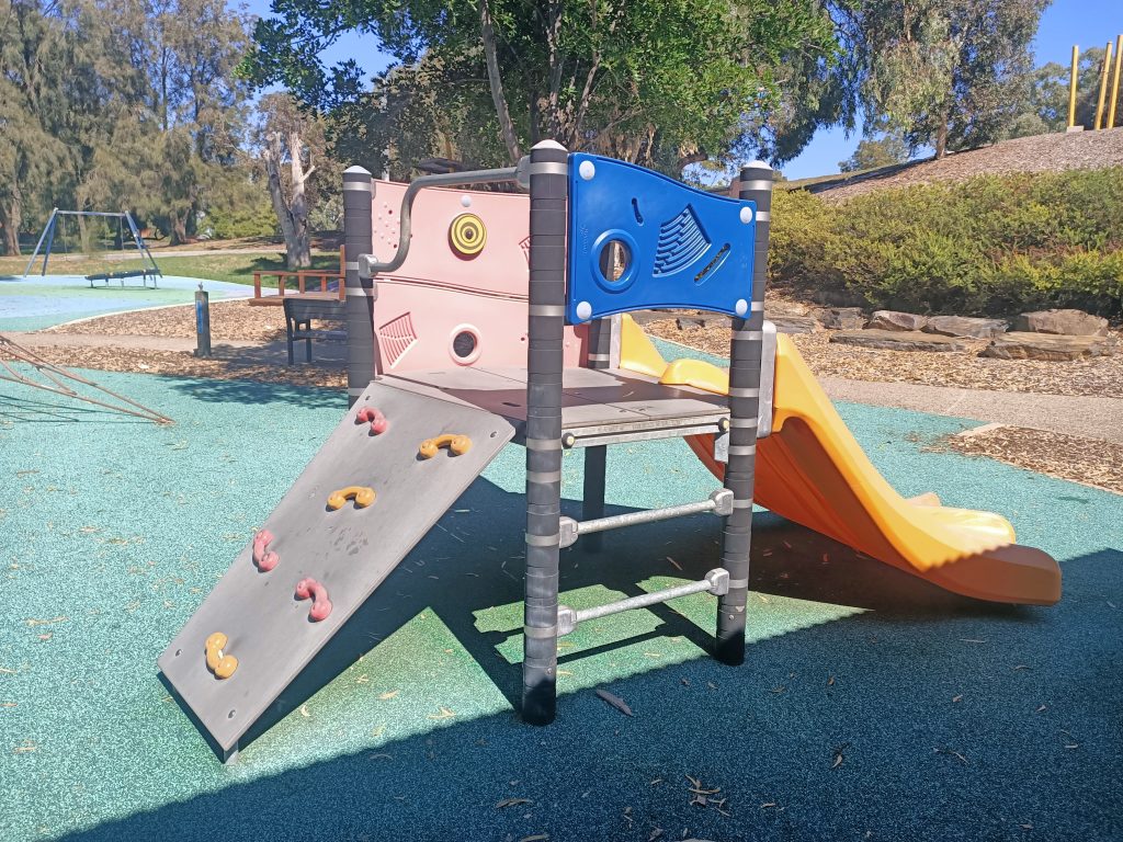 Climbing board on the back of the slide.