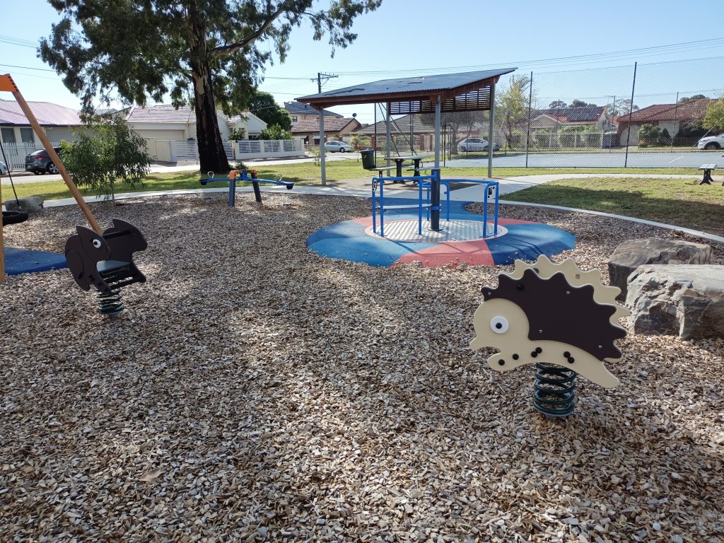 Barkchips, rocker and spinning play equipment