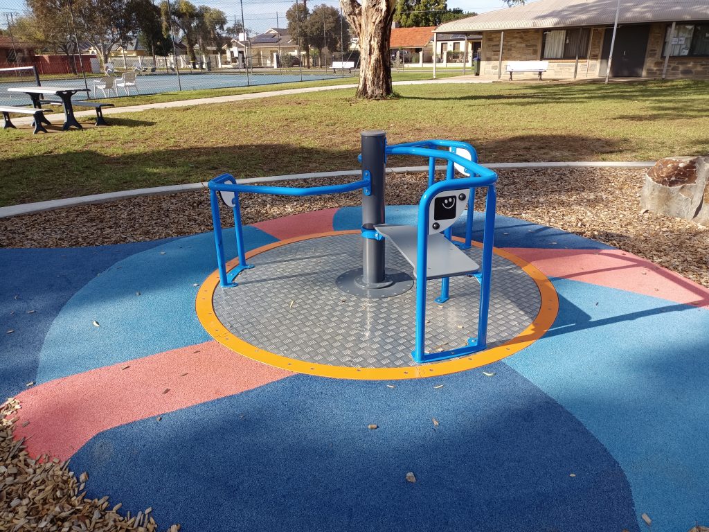 Spinning equipment with tennis court in the background