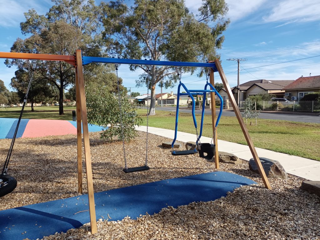 Swing set with adult child swing