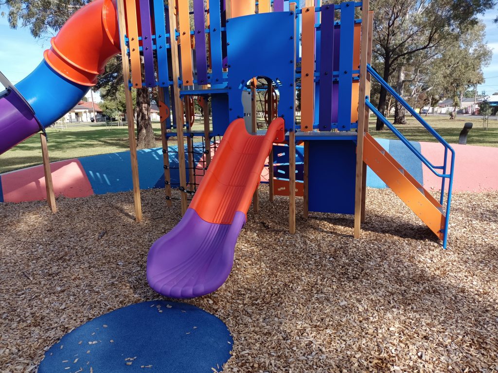 Small childrens red and purple slide