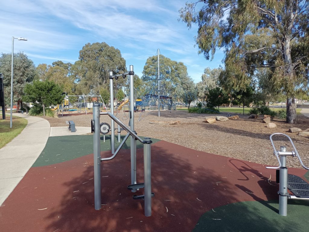 Outdoor fitness equipment adjacent playground