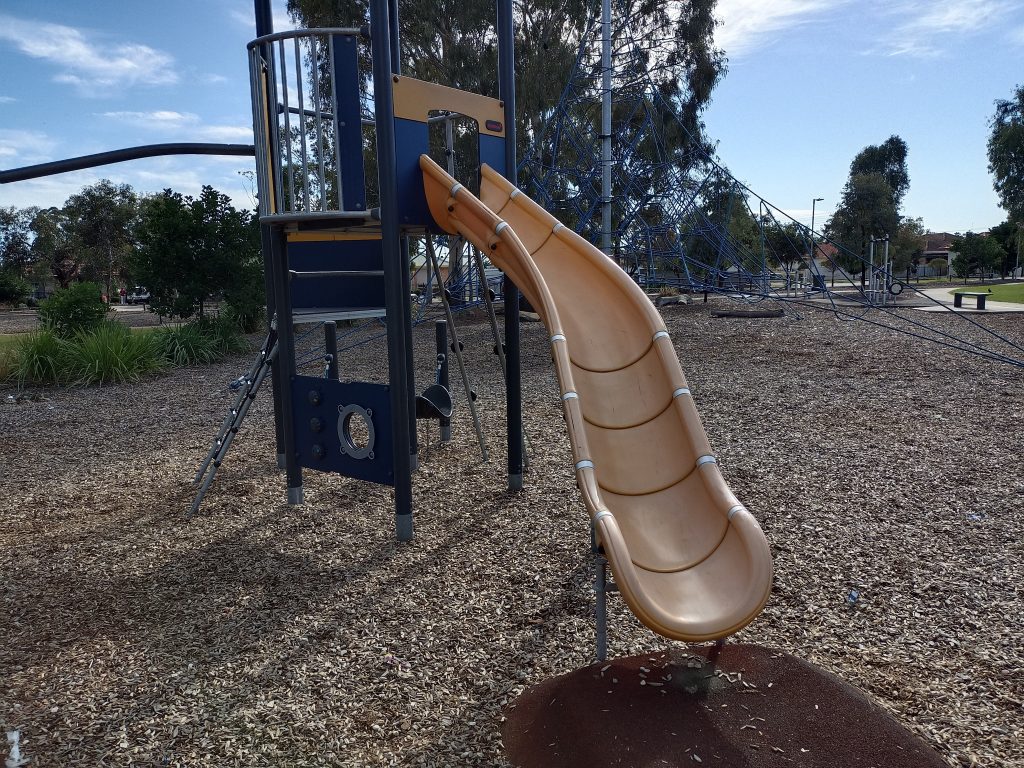 Yellow slide and blue climbing equipment