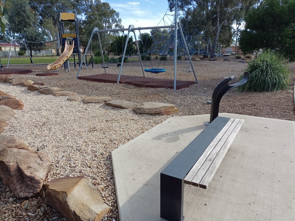 Park bench with water fountain