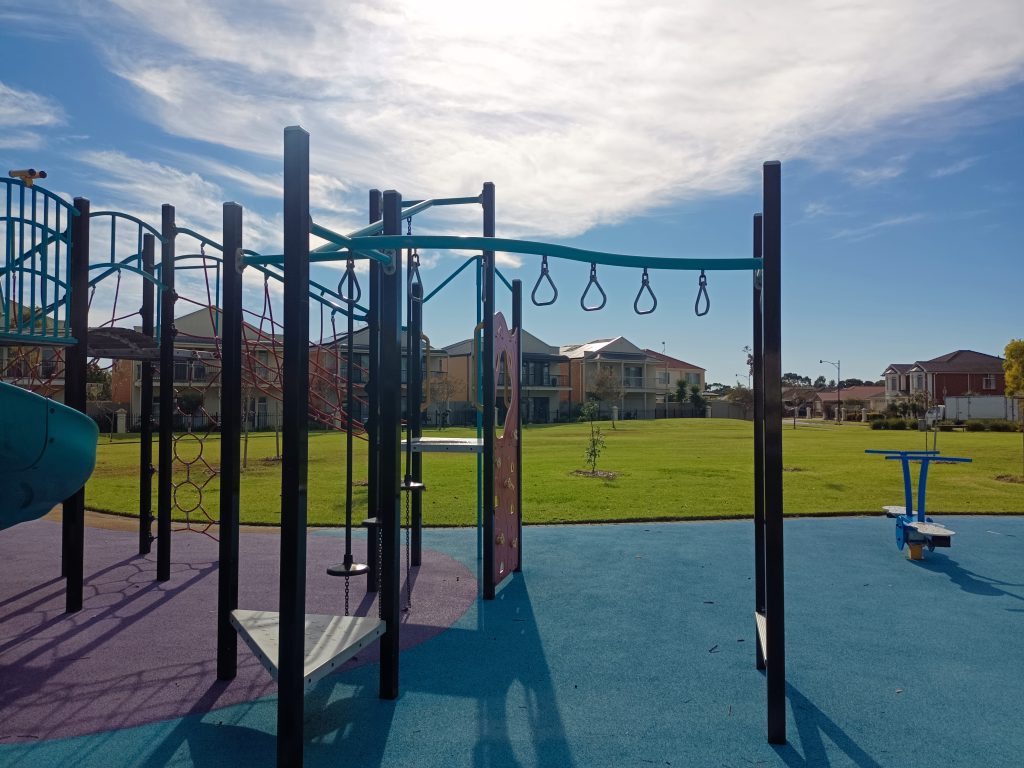monkey bars with ferryden park houses behind