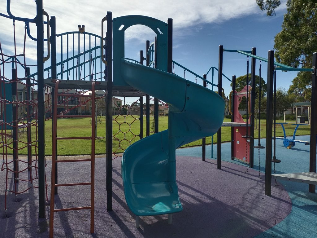 blue slide and climbing play equipment